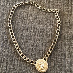 Gold lions head chain necklace
